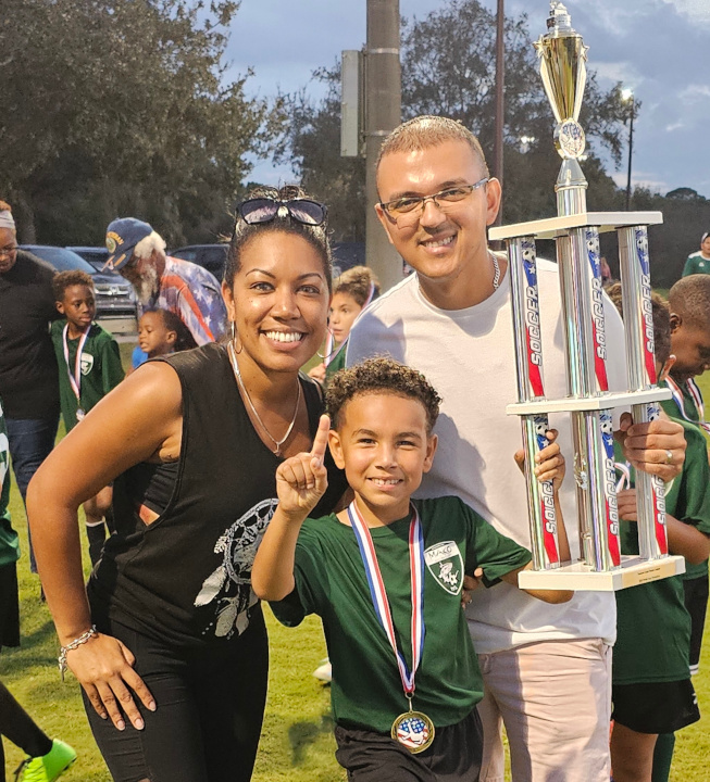 Vincenzo & family holding trophy